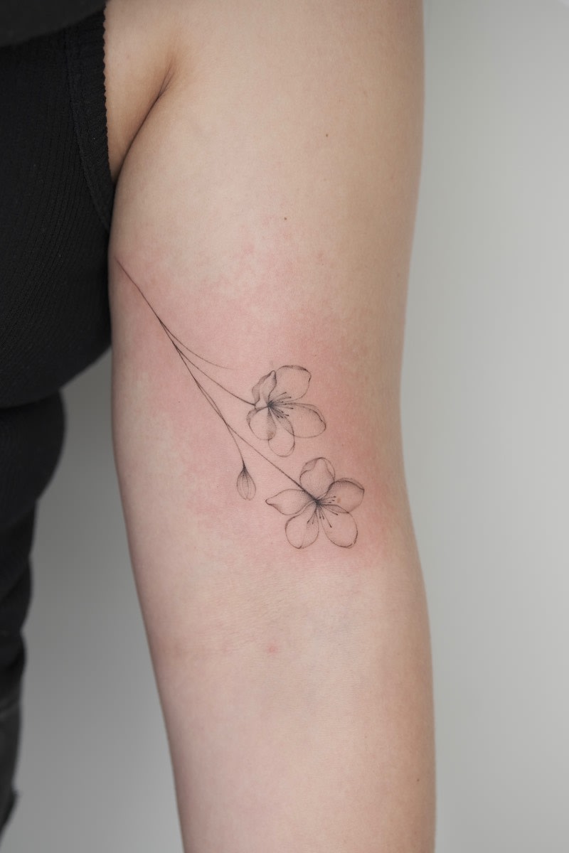 Fine line botanical tattoo by Ling