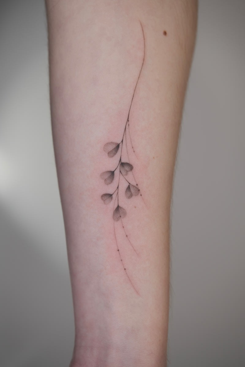 Delicate floral fine line tattoo by Ling